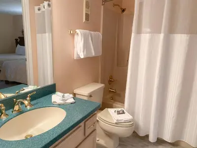 a bathroom with a sink and a toilet and a shower at Edgewater 1-0110 'Best Ocean View' in Panama City Beach