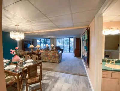 a dining room and living room with a dining table at Edgewater 1-0110 'Best Ocean View' in Panama City Beach