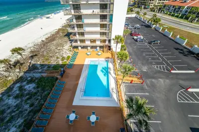 an overhead view of a hotel with a swimming pool and the beach at Edgewater L608 'Turquoise Turtle' in Panama City Beach