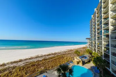 a view of the beach from the balcony of a resort at Edgewater 2-0405 'Make Some Waves' in Panama City Beach