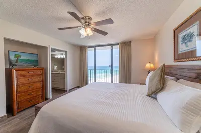 a bedroom with a bed and a ceiling fan at Edgewater 3-0814 'Pelican Watch' in Panama City Beach