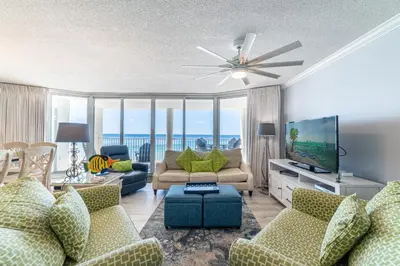 a living room with a couch and a flat screen tv at Long Beach 3-0501 ‘Edie's Escape' in Panama City Beach
