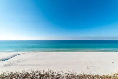 an empty beach with the ocean in the background at Edgewater 3-1009 'Paradise Palms' in Panama City Beach