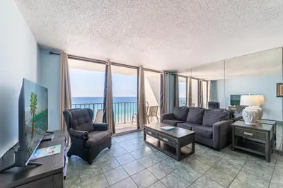 a living room with a couch and chairs and a television at Edgewater 3-1009 'Paradise Palms' in Panama City Beach