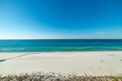 an empty beach with the ocean in the background at Edgewater 3-1009 'Paradise Palms' in Panama City Beach