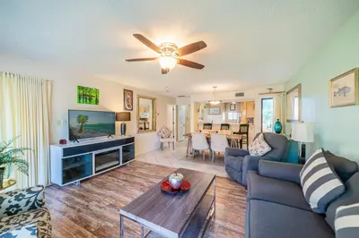 a living room with a couch and a table at Edgewater Villa 0955 'Fountain of Youth' in Panama City Beach