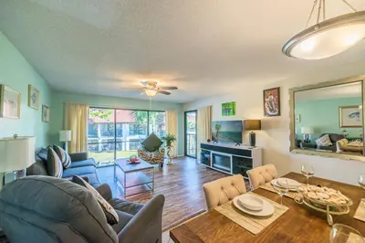 a living room with a couch and a table at Edgewater Villa 0955 'Fountain of Youth' in Panama City Beach