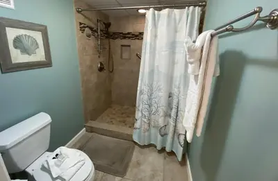 a bathroom with a shower and a toilet at Edgewater 2-0602 'Beach Blessings' in Panama City Beach