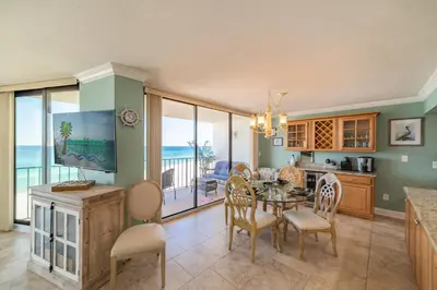 a kitchen and dining room with a table and chairs at Edgewater 2-0602 'Beach Blessings' in Panama City Beach