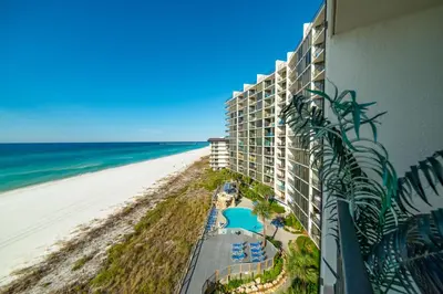 a view of the beach from the balcony of a resort at Edgewater 2-0602 'Beach Blessings' in Panama City Beach