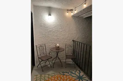a table and chairs in a room with a wall at Edgewater Villa 1510 'Beach & Golf' in Panama City Beach
