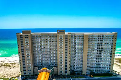 a large building on the beach next to the ocean at Emerald Beach 2234 'Seas The Dream South' in Panama City Beach