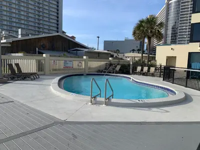 a small swimming pool in the middle of a building at Sunbird 1104E 'Flamingo Palms' in Panama City Beach
