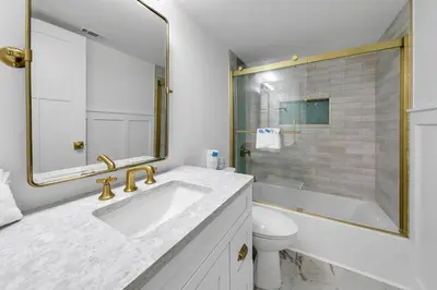 a white bathroom with a sink and a toilet at Pinnacle Port B3-408-Emerald Pearl in Panama City Beach