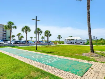 a basketball court in a park with palm trees at Pinnacle Port B3-408-Emerald Pearl in Panama City Beach