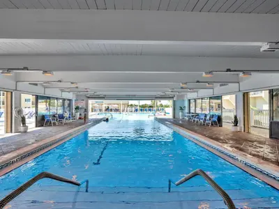 a large swimming pool with blue water at Pinnacle Port B3-408-Emerald Pearl in Panama City Beach