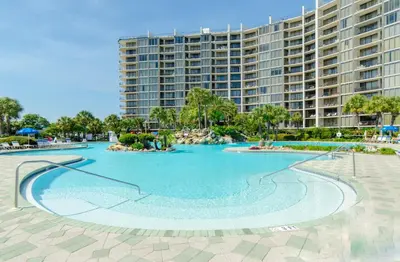 a large swimming pool in front of a large building at Edgewater 1-0708 'Beach Happy' in Panama City Beach