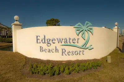 a sign for the beach resort at a resort at Edgewater 1-0708 'Beach Happy' in Panama City Beach