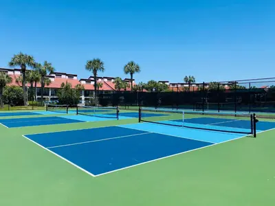 two tennis courts on a tennis court at Edgewater 3-0905 'Gone Coastal' in Panama City Beach