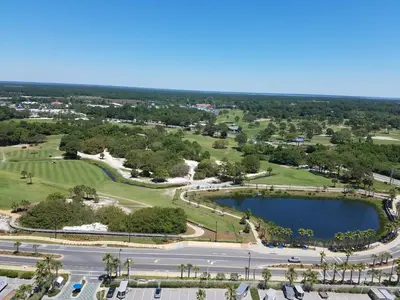 an aerial view of a park with a lake at Boardwalk 1409 'Emerald Ray' in Panama City Beach