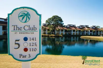 a sign in front of a building with a pool of water at Edgewater Villa 1303 'Gone Gulf'N' in Panama City Beach