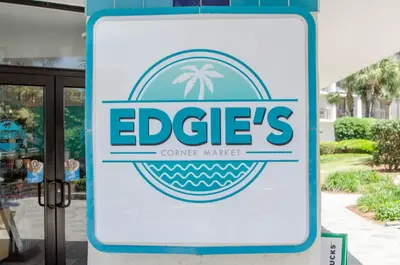 a sign for an eddie s corner market at Edgewater Villa 1303 'Gone Gulf'N' in Panama City Beach