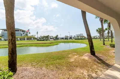 a view of a pond in front of a building at Edgewater Villa 1303 'Gone Gulf'N' in Panama City Beach
