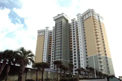 two tall buildings with palm trees in front of them at Boardwalk 0810 'Endless Summer' in Panama City Beach