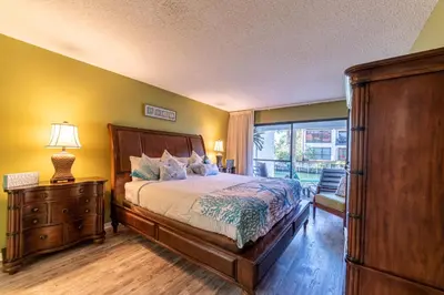 a bedroom with a large bed and a window at Edgewater Villa 2205 'Turtle Dunes' in Panama City Beach