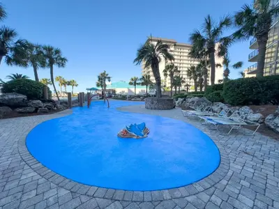 a large blue circle in a playground with a swing at Edgewater Villa 2205 'Turtle Dunes' in Panama City Beach