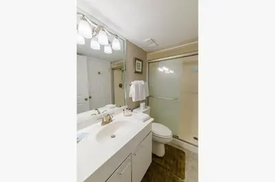 a bathroom with a sink and a toilet at Dunes of Panama E1703 'After-Dune Delight' in Panama City Beach