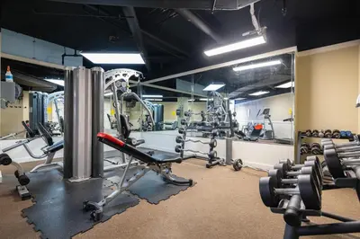 a gym with several treadmills and weights at Dunes of Panama E1703 'After-Dune Delight' in Panama City Beach