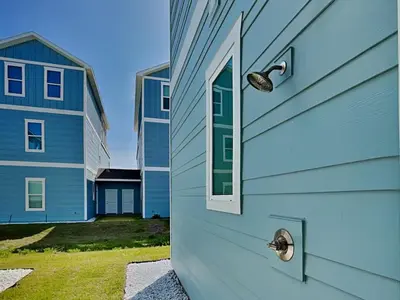 a door with a window on the side of a house at The Blue Pearls in Panama City Beach
