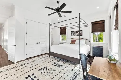a bedroom with a bed and a ceiling fan at 30Yay! by 30A Escapes in Watersound Beach