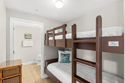 a bedroom with two bunk beds in a room at Tidewater Beach Resort #1110 by Book That Condo in Panama City Beach