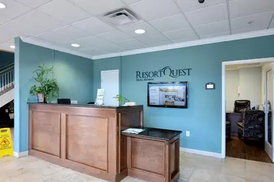 an office with a reception desk and a blue wall at Tidewater Beach Resort #1110 by Book That Condo in Panama City Beach