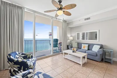 a living room with a couch and a table at Tidewater Beach Resort #1110 by Book That Condo in Panama City Beach