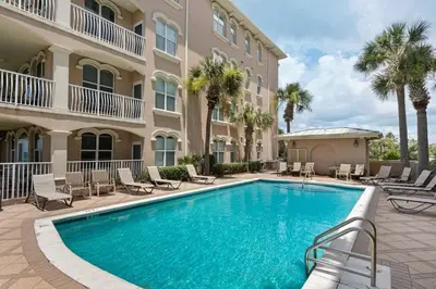 a swimming pool in front of a building at Monterey C-201 in Seacrest