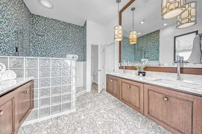 a large bathroom with two sinks and a shower at Ocean Front Property in Seacrest