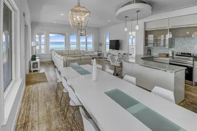 a kitchen and living room with a table and chairs at Ocean Front Property in Seacrest