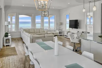 a living room with a couch and a table at Ocean Front Property in Seacrest