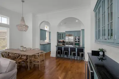 a dining room and kitchen with a table and chairs at Scout's Lookout in Inlet Beach