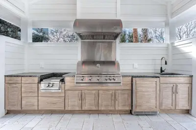 a kitchen with a stove top oven in a house at Paradise Found 30A in Seacrest