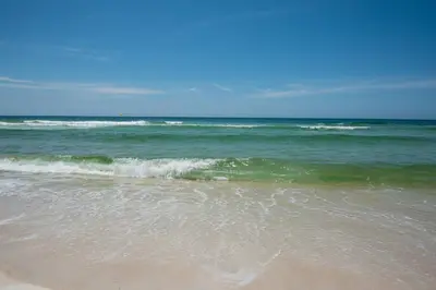 a beach with the ocean in the background at Beachwood Villas 7G in Santa Rosa Beach