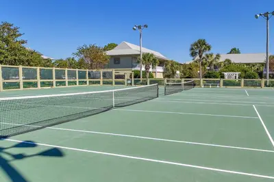 a tennis court with two tennis courts at Beachwood Villas 7G in Santa Rosa Beach