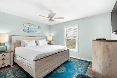 a bedroom with a bed and a window at Cloud Nine By the Sea in Inlet Beach
