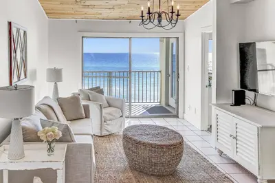a living room with a couch and a view of the ocean at Beachside 10 in Santa Rosa Beach