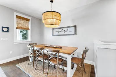 a dining room with a table and chairs at Saltwater Sanctuary in Santa Rosa Beach