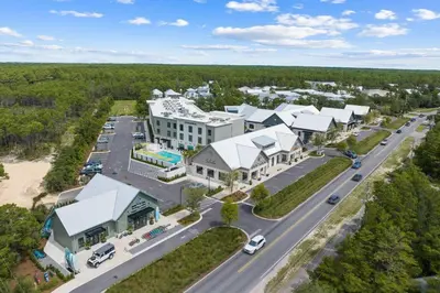 an aerial view of a large building with a road at Saltwater Sanctuary in Santa Rosa Beach