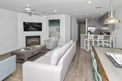 a living room with a couch and a table at Monterey B-102 in Seacrest